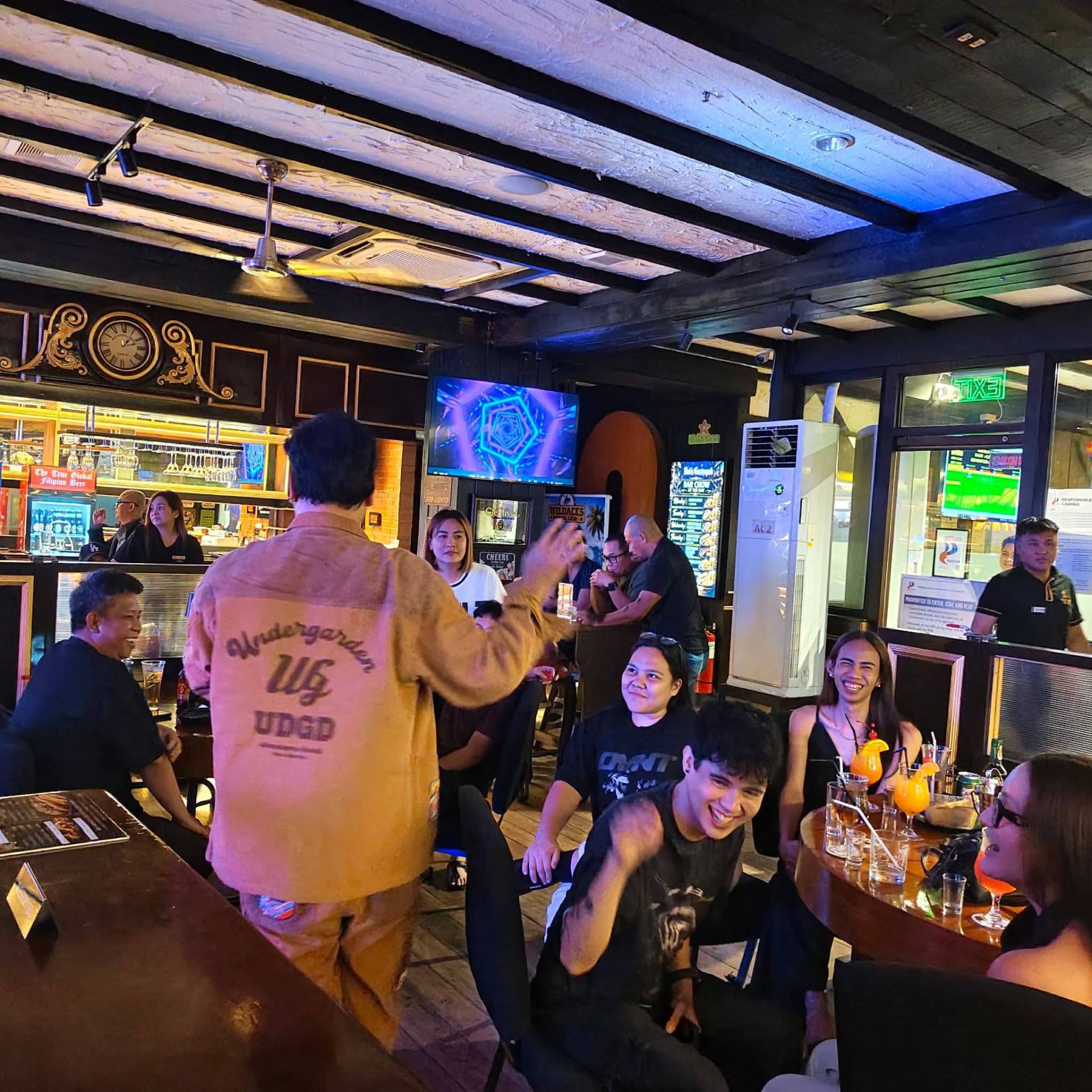 Lively crowd toasting in the pub